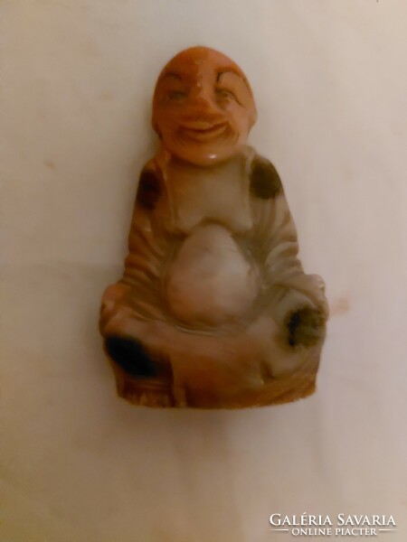 Antique fat stone buddha statue