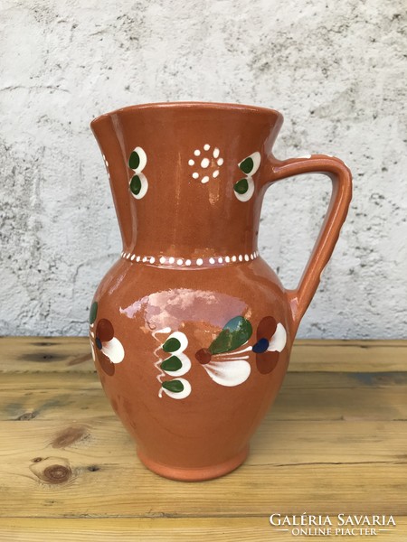 Glazed flower-patterned folk ceramic jug-vase