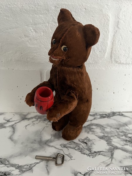 Old wind-up automatic toy teddy bear
