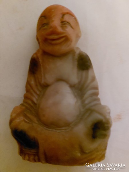 Antique fat stone buddha statue