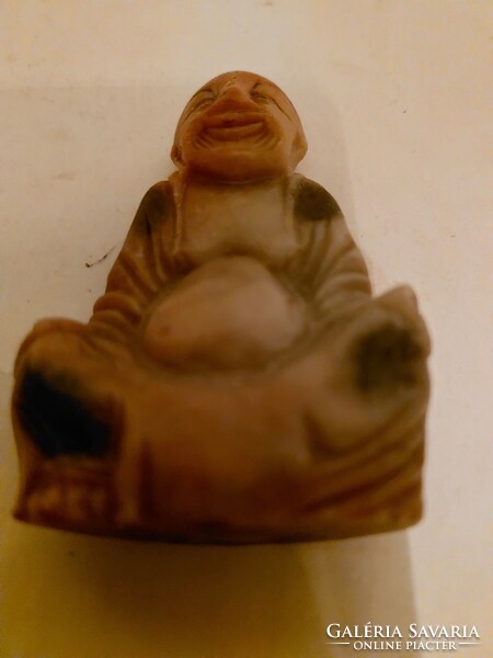 Antique fat stone buddha statue