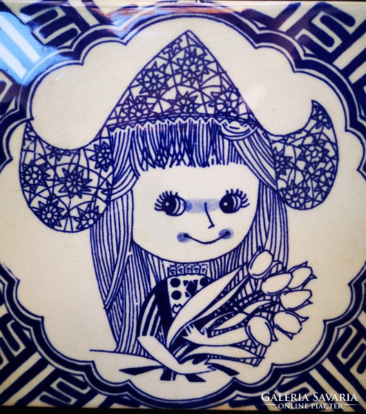 Dutch tile with a little girl pattern