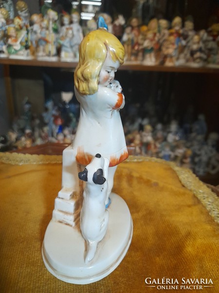 German, Germany Grafenthal, hand-painted porcelain figurine of a little girl petting a dog and cat. 15 Cm.