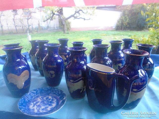 Collection of 14 + 2 cobalt blue horoscope vases, 15.2 cm high