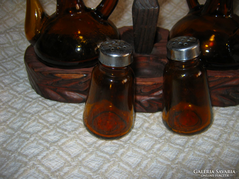 Old vinegar oil pouring salt pepper shaker in table holder in amber