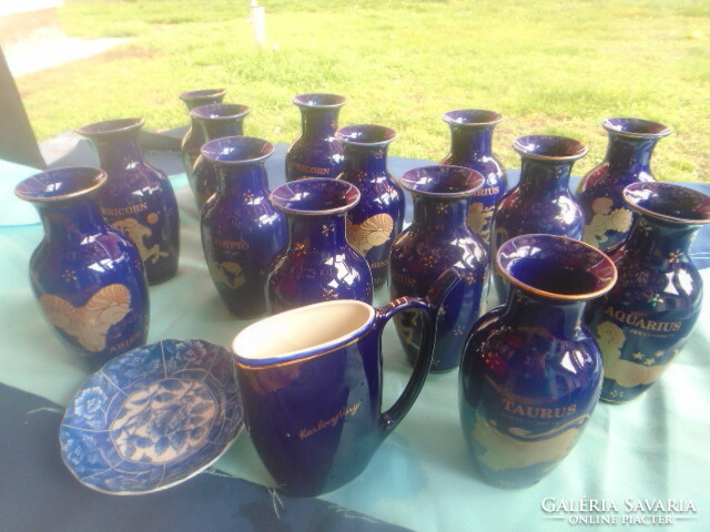 Collection of 14 + 2 cobalt blue horoscope vases, 15.2 cm high