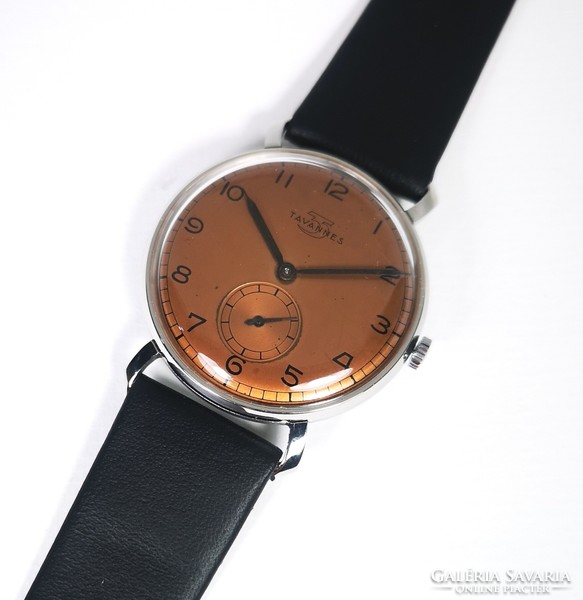 A special tavannes wristwatch with a bronze brown dial from around 1945! With Tiktakwatch service card!