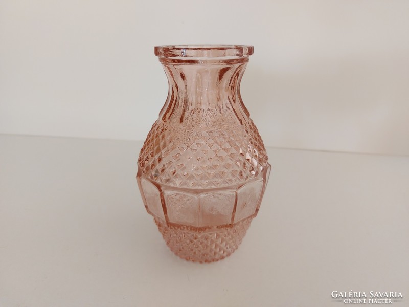 Old glass vase in pink vintage vase