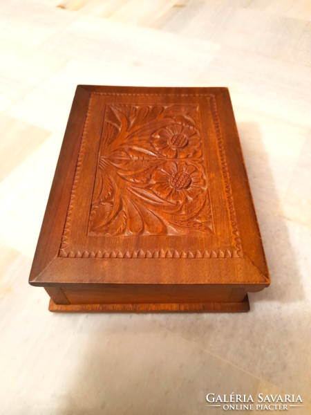 Carved wooden box, cigarette, cigar box decorated with a retro folk motif