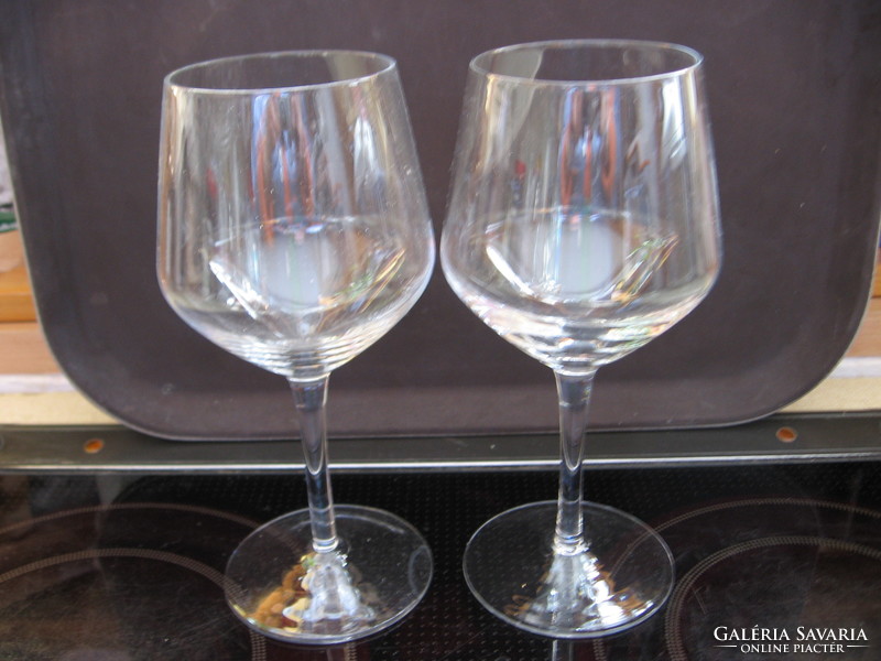 2 large, elegant stemmed champagne glasses for wedding occasions.