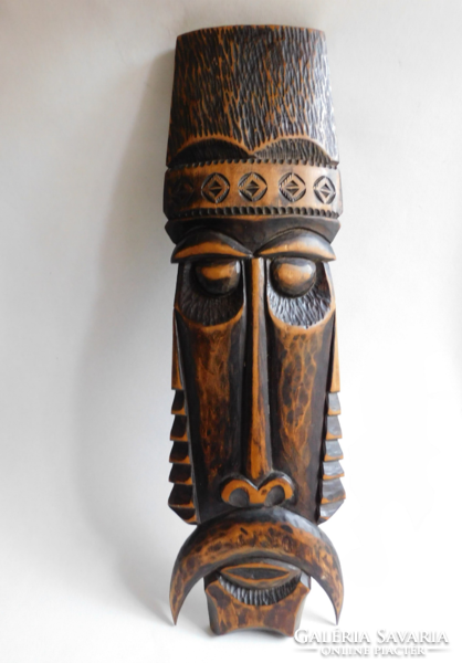 Large, folk art carved wall ornament - head - with markings