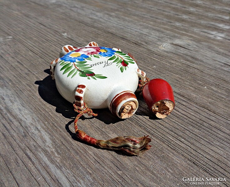 Small ceramic souvenir with Kassa inscription, water bottle