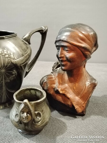 Antique art nouveau tin pourers, a female terracotta portrait in one