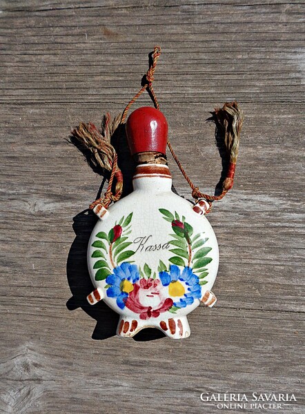 Small ceramic souvenir with Kassa inscription, water bottle