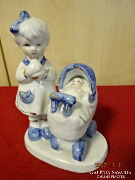 Chinese porcelain figure, little girl with a pram, height 15 cm. He has! Jokai.