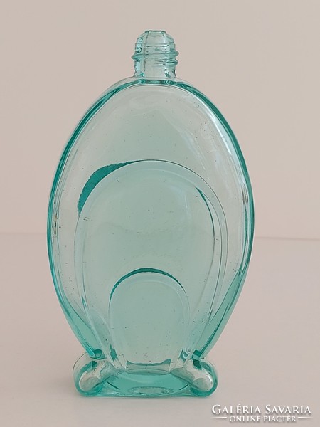 Old art deco perfume bottle in turquoise vintage cologne bottle