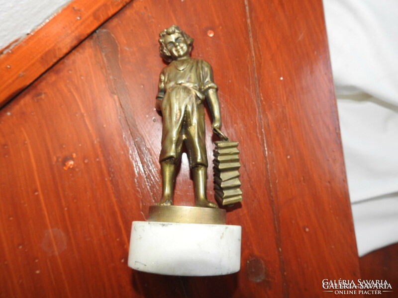 Shoeing little boy - bronze statue on a marble base