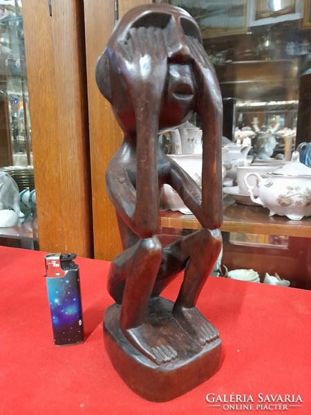 Hand-carved solid wood figural sculpture.