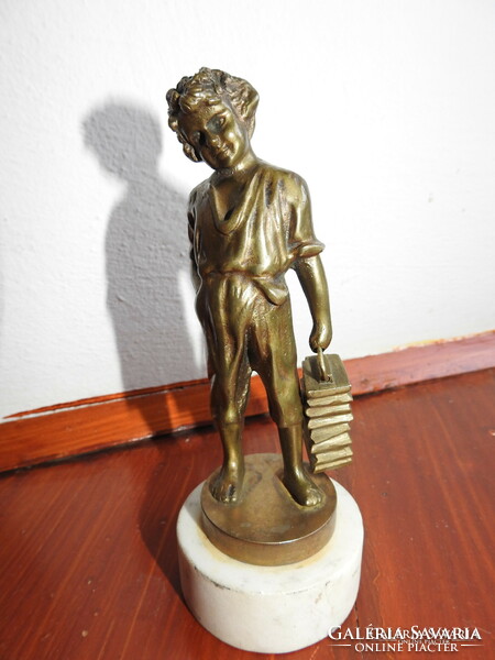 Shoeing little boy - bronze statue on a marble base