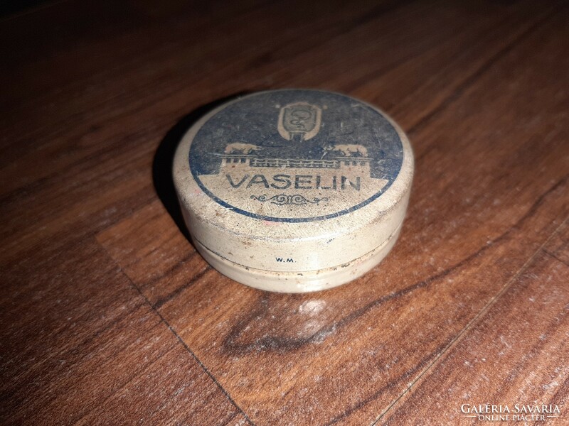 Antique metal box in vaseline