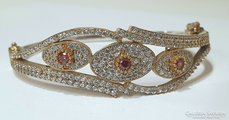 Silver-gilt (925) women's bracelet richly decorated with stones,