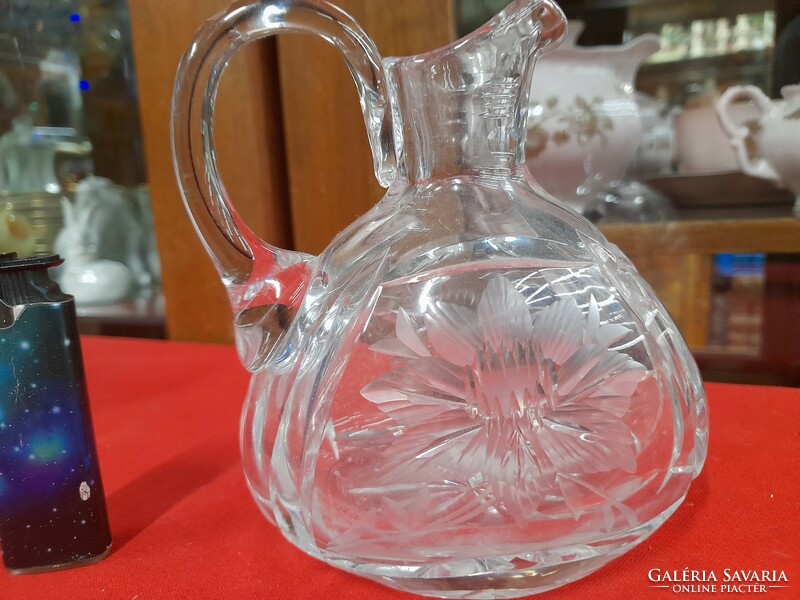 Polished thick glass jug with spout.