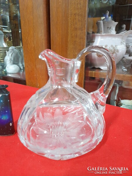 Polished thick glass jug with spout.