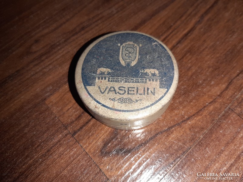 Antique metal box in vaseline