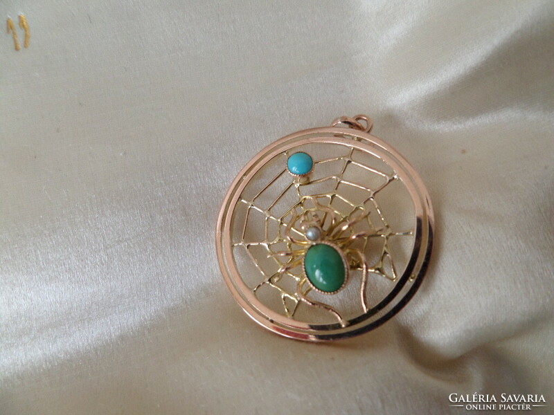 Gold cobweb pendant with turquoises