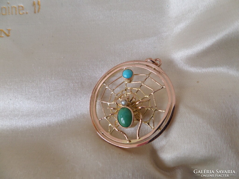 Gold cobweb pendant with turquoises