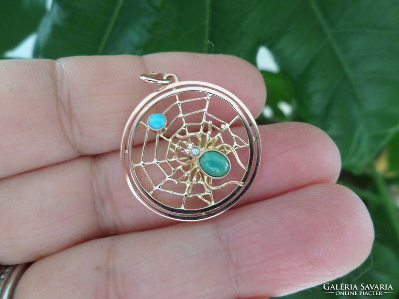 Gold cobweb pendant with turquoises