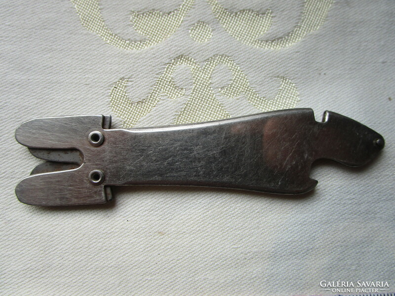 Antique iron knife sharpener and beer opener