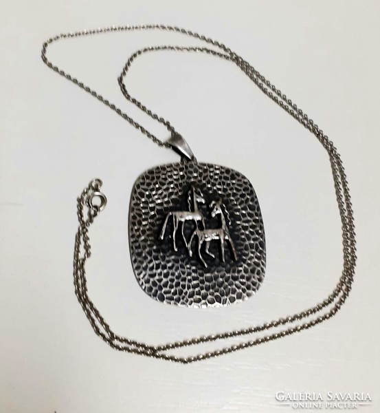 Silver-plated pendant on a long chain made with retro industrial art handwork