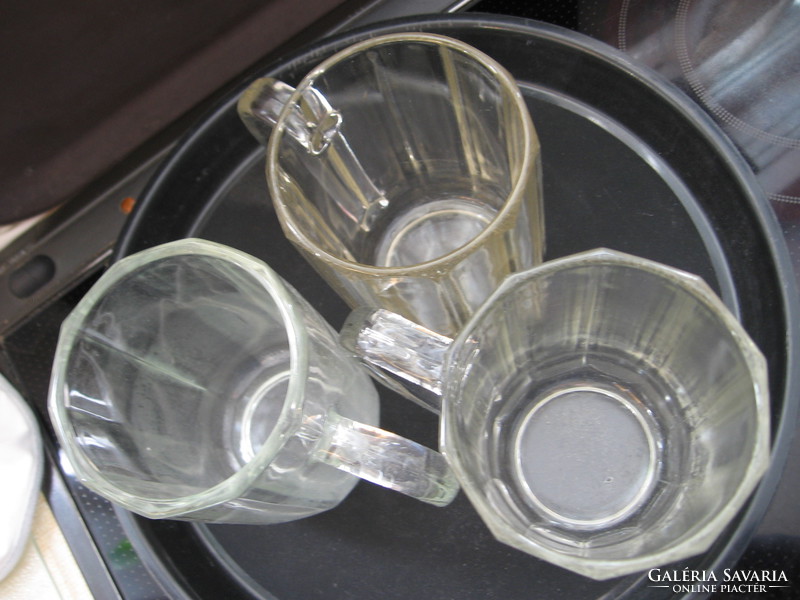 Antique, calibrated 0.5 l jugs polished on a plate