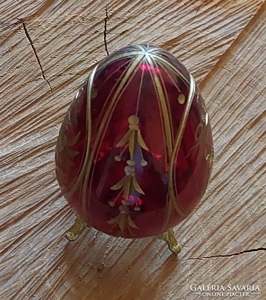 Polished crystal Faberge egg with a gilded eagle motif