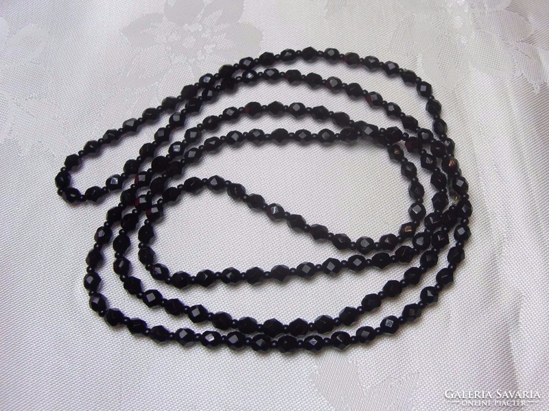 Row of old Czech faceted black glass beads