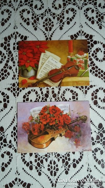 Két szájjal festett képeslap hegedűvel