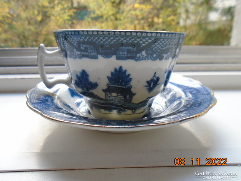 Cobalt blue painted oriental willow pattern English teacup with saucer