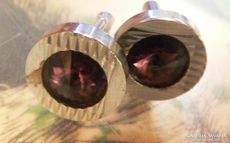 Pair of elegant metal cufflinks with purple stones