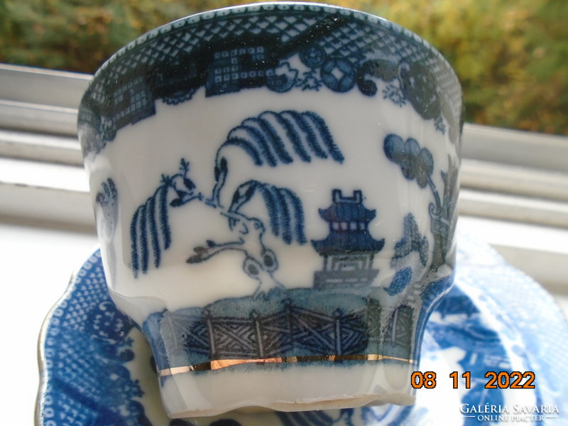 Cobalt blue painted oriental willow pattern English teacup with saucer