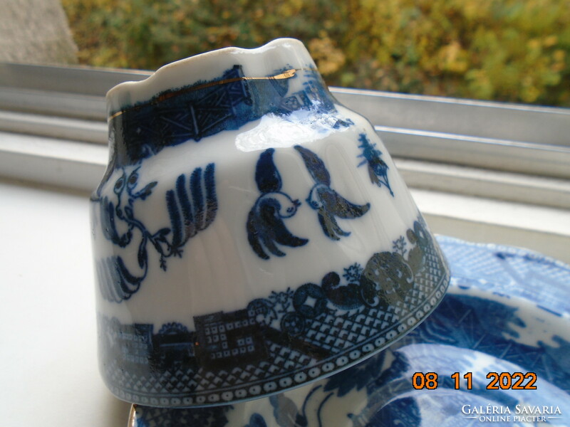 Cobalt blue painted oriental willow pattern English teacup with saucer