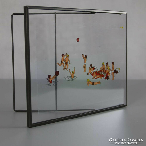 Transparent retro slide projector image in a metal frame. Beach&ball