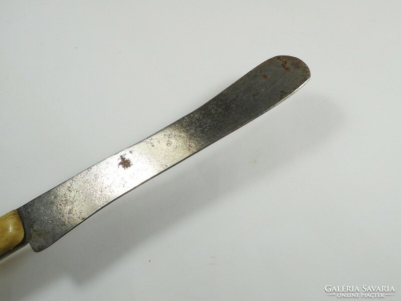 Antique old buttering knife with riveted bone handle, rounded end, tip, approx. From the 1920s.