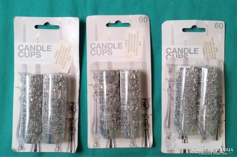 3 Packs of silver foil candle holders, one pack is missing