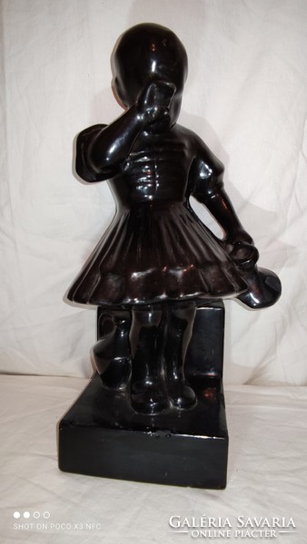 Large contz marked ceramic girl jug with black glazed bookend