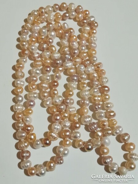 120 cm long cultured pearl necklace.