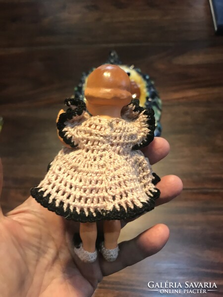 A tiny celluloid doll