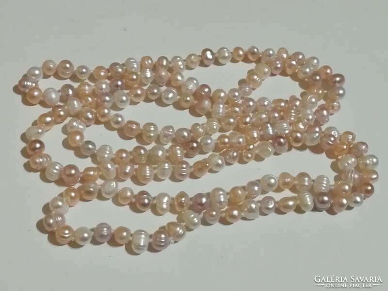 120 cm long cultured pearl necklace.