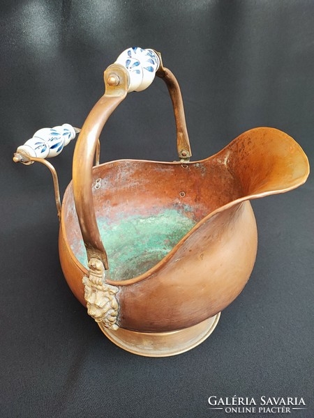 Antique copper coal pourer with porcelain handle.