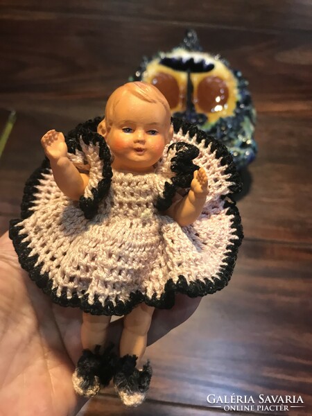 A tiny celluloid doll